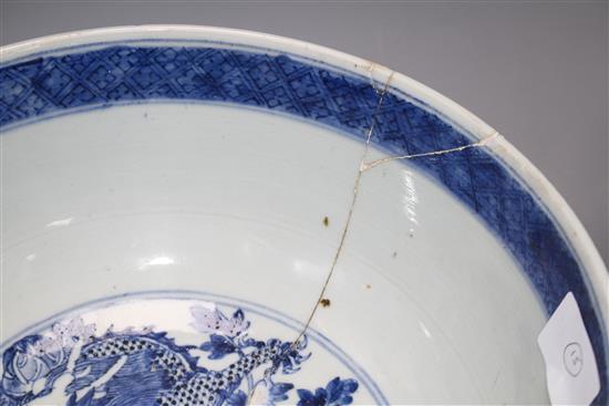 A large Chinese blue and white bowl, 29.5cm a prunus jar, height 12cm and a Kangxi blue and white fluted saucer, 11cm